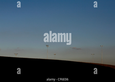 Floodlights on a hill at twilight. Newcastle started life as a Roman fort (Pons Aelius) along Hadrian's Wall, the border between Stock Photo