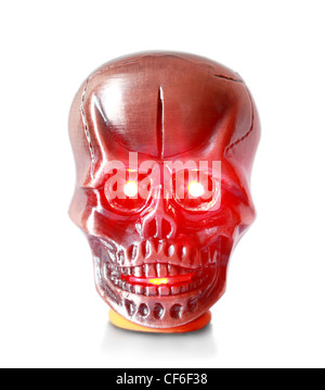 Lighter in the form metallic red skull on a pedestal with a glowing red eyes and mouth Stock Photo