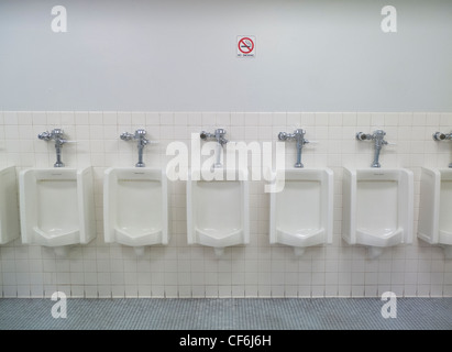 mens restroom urinals Stock Photo - Alamy