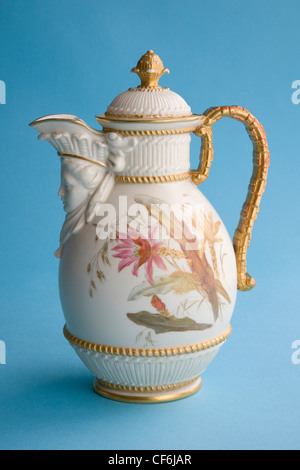 Ceramic jug with cover, hand-painted with cactus flowers and produced in 1890 by the Royal Worcester factory. Stock Photo