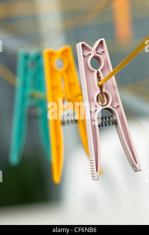 Pegs on a clothes line in British garden. Stock Photo