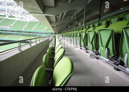 DUBLIN JUNE 10 Many rows green plastic folding seats big empty stadium Aviva June 10 2010 Dublin Stadium Aviva repair Stock Photo