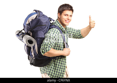 A portrait of a man with backpack giving thumb up isolated on white background