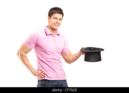 A smiling man holding a top hat isolated on white background Stock Photo