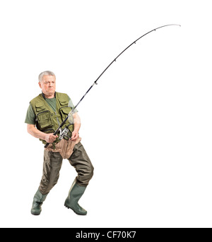 Full length portrait of a mature fisherman holding a fishing pole isolated on white background Stock Photo