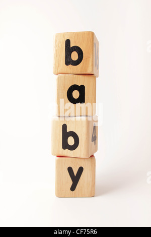 Stacked wooden blocks spelling the word baby Stock Photo