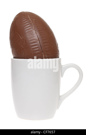 Chocolate Easter Egg in a plain white mug Stock Photo