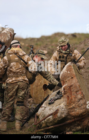 A short film production at Southport Beach replicating the Afghan conflict using beach debris as a back-drop, Merseyside, UK Stock Photo