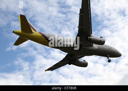 Plane in a cloudy sky, Flugzeug am bewölkten Himmel Stock Photo