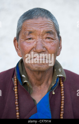 Old Ladakhi man in traditional dress at Lamayuru, (Ladakh) Jammu & Kashmir, India Stock Photo