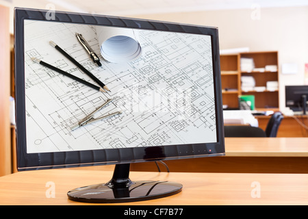 Computer monitor with blueprints and drawing tools picture in screen on desktop Stock Photo