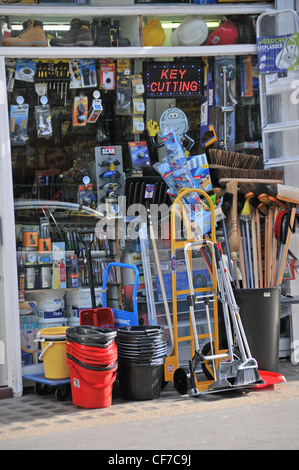 Hardware store brushes buckets ladders keys cut tools household good Stock Photo