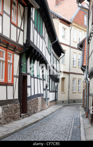 Timber framed houses and cobbled street in Wernigerode, Germany Stock Photo