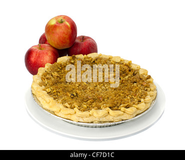 Freshly baked apple pie on white plate with red apples Stock Photo