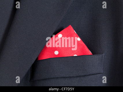 Folder linen handkerchiefs in red with white spots in top pocket of blazer Stock Photo