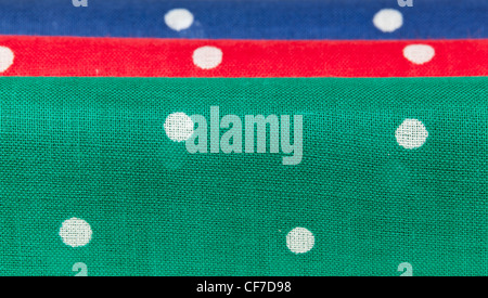Folder linen handkerchiefs in red blue and green with white spots Stock Photo