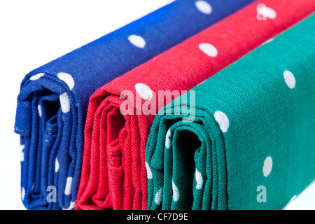 Folder linen handkerchiefs in red blue and green with white spots Stock Photo