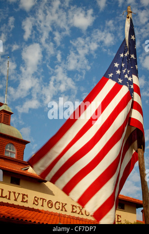 US Flag waiving in the wind outside the Forth Worth Stock Exchange building. Stock Photo