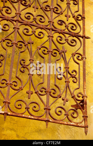 Colorful wall with wrought iron pattern in upscale neighborhood Santana Row, California. Stock Photo