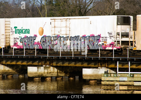 'The Great Escape' graffiti on a Tropicana boxcar on a CSX railroad bridge crossing over the Anacostia River in Washington DC Stock Photo