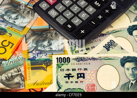 Australia and Japanese currency pair commonly used in forex trading with calculator Stock Photo