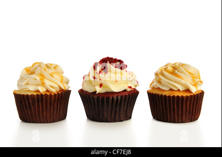 Three cupcakes in a row. Isolated on white Stock Photo