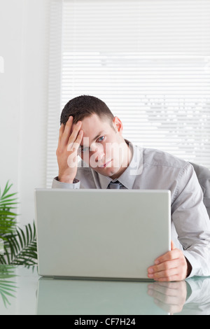 Close up of businessman having a problem with his laptop Stock Photo