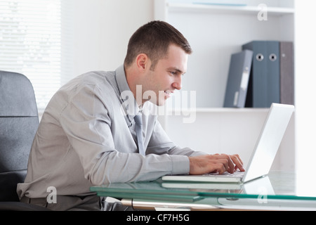 Businessman working concentrated on his laptop Stock Photo