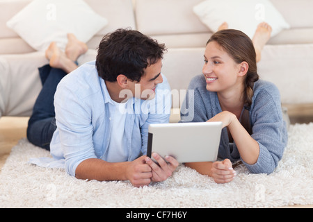 Cute couple using a tablet computer Stock Photo