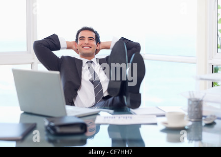 Satisfied businessman relaxing Stock Photo