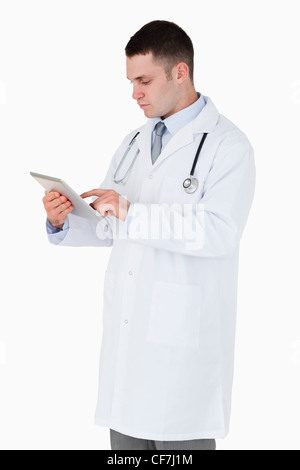 Doctor using tablet computer Stock Photo