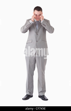 Portrait of a young businessman having a headache Stock Photo