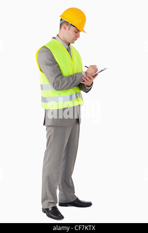 Portrait of a young contractor taking notes Stock Photo