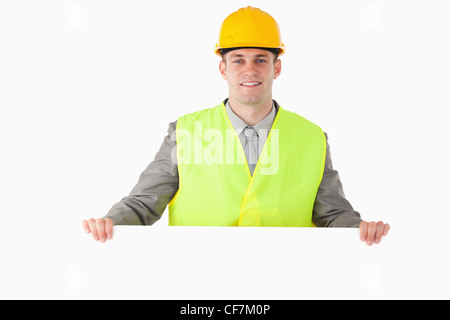 Builder holding a blank panel Stock Photo