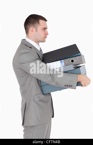 Portrait of a businessman holding a stack of binders Stock Photo