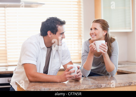 Cheerful couple having coffee together Stock Photo