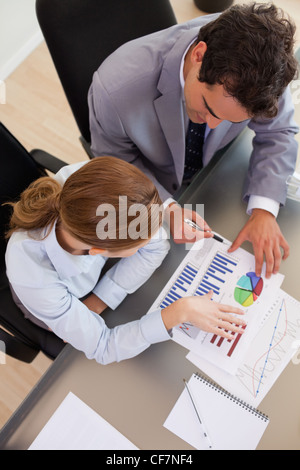 Above view of business people analyzing data Stock Photo