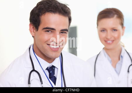 Smiling assistant doctors standing next to each other Stock Photo