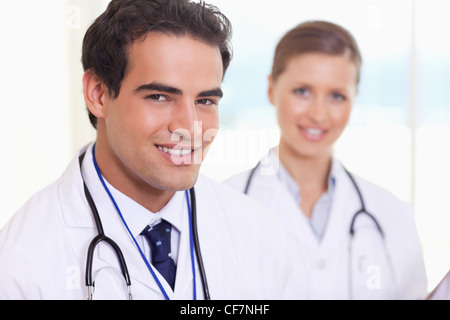 Smiling medical assistants standing next to each other Stock Photo