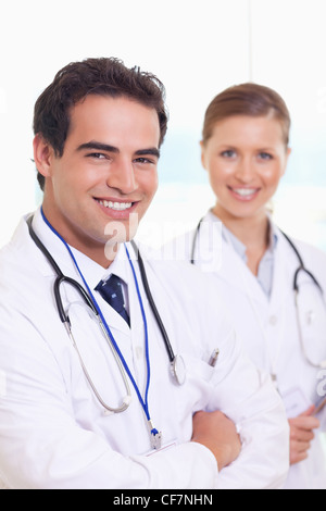 Smiling medical team standing next to each other Stock Photo