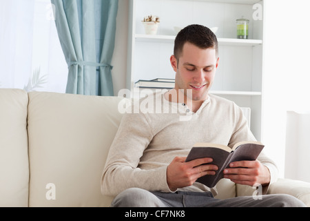 Handsome man reading a book Stock Photo