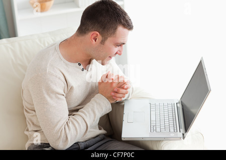 Young man using a laptop Stock Photo