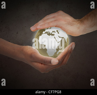 Hands protecting a glowing planet globe Stock Photo