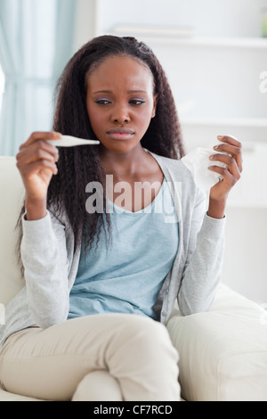 Ill woman on couch Stock Photo