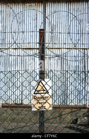 Danger razor wire sign Stock Photo