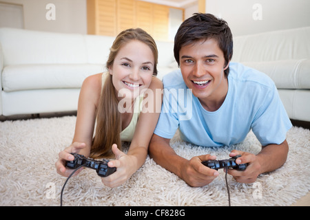 Smiling couple playing video games Stock Photo