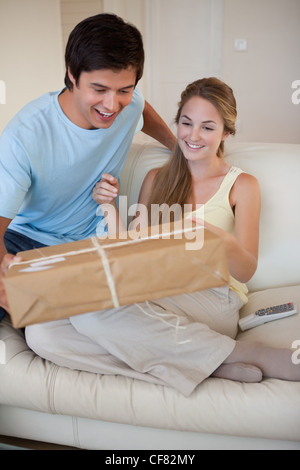 Portrait of a couple looking at a package Stock Photo