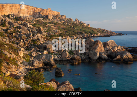 Panorama of the rugged boulder ranges and rearing headlands on the north coast of Gozo west from Dahlet Qorrot. Stock Photo