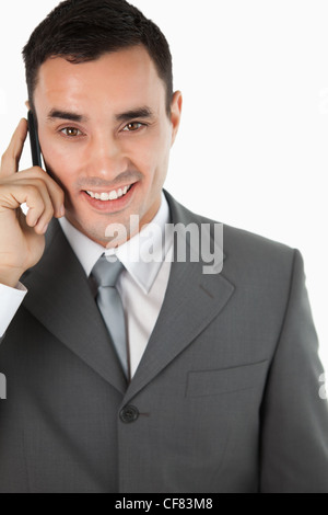 Close up of friendly smiling businessman on the phone Stock Photo
