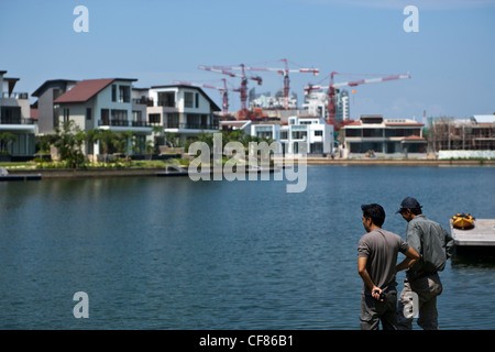 Waterfront luxury homes and condominium apartments are seen at Sentosa Cove in Singapore. Stock Photo